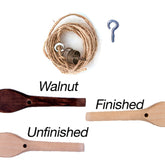 The image shows the Kromski Brake Band Set for Fantasia with Peg by Kromski North America, featuring a bundle of hemp string, a metal hook eye, a metal cylindrical object, and three wooden spools labeled "Walnut," "Unfinished," and "Finished." The "Walnut" spool has a darker color, while the "Unfinished" and "Finished" spools are lighter.