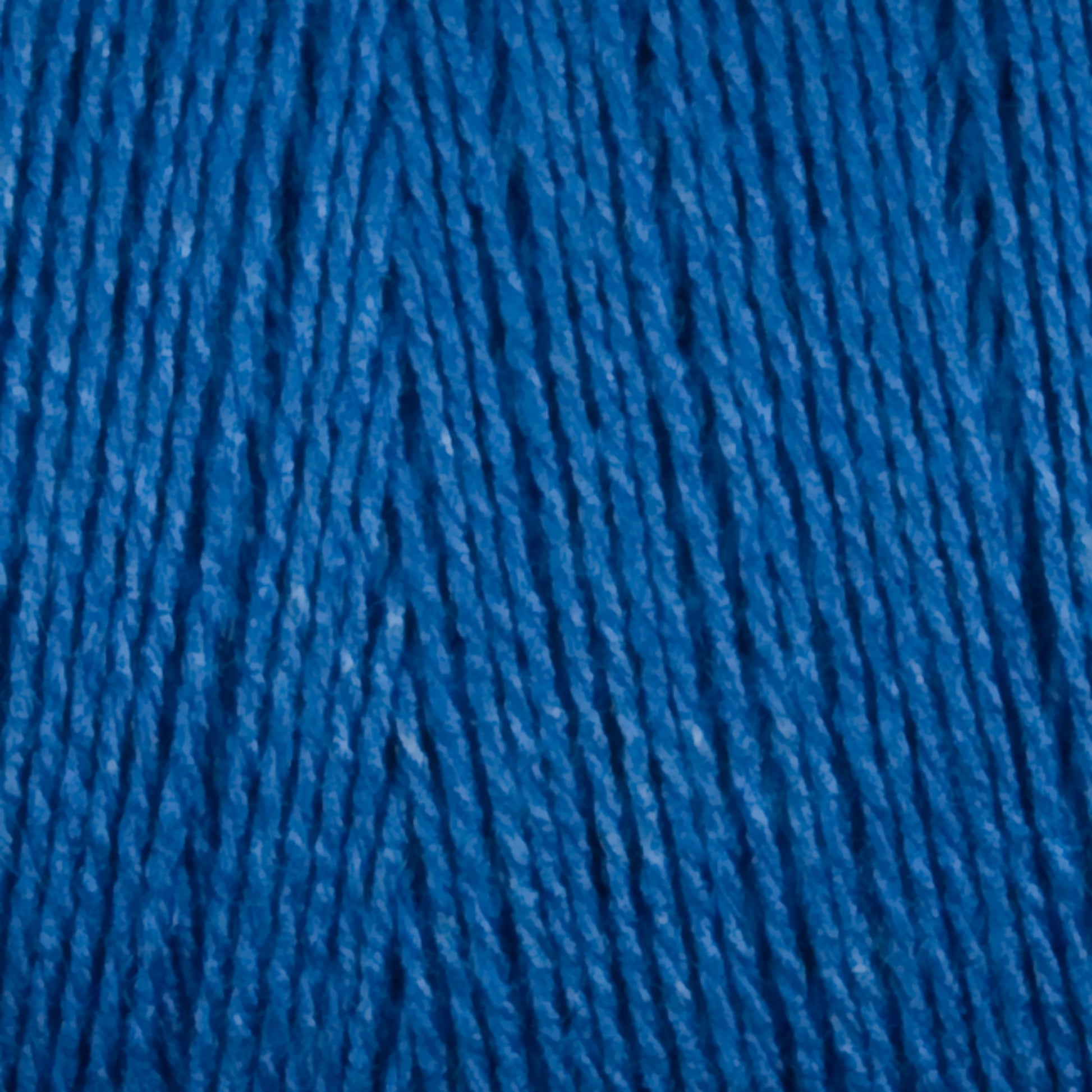 A close-up view of Maurice Brassard's 8/2 Tencel Yarn on a Mini Cone, neatly arranged in parallel strands. The texture appears soft and slightly fuzzy, highlighting the individual threads and their twisted formation. Perfect for weaving projects, the rich blue color is vibrant and consistent throughout the image.