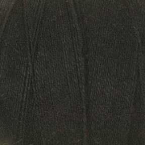 Close-up image of Maurice Brassard's 8/2 Cottolin Organic Yarn in black. The texture is visible with fine strands of fiber creating a soft, knitted appearance. The yarn appears tightly wound, showcasing its uniform color and consistency, perfect for crafting tea towels from the cotton-linen blend in the Cottolin Tea Towel Kit.