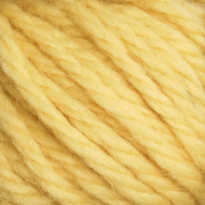 Close-up of the soft, hand-dyed yellow strands of Halcyon Yarn Classic Rug Wool by Caledonian Dye Works, tightly wound together to showcase the texture and slight fuzziness of the fibers. The yarn appears thick and uniformly spun, making it suitable for knitting or crocheting projects. The color is a rich, warm yellow. It’s ideal for classic rug wool creations by skilled rug weavers.