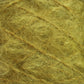 Close-up image of a bundle of Victorian Brushed Mohair Yarn | Mini Skein by Caledonian Dye Works. The texture is rough and fibrous, with a tangled, interwoven appearance reminiscent of traditional jute fibers. The yarn is light brown, yellowish, or golden in color and appears dense and matted.