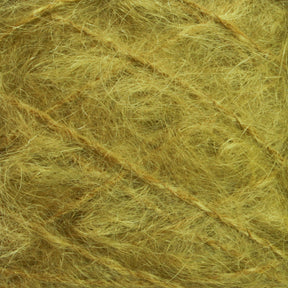 Close-up image of a bundle of Victorian Brushed Mohair Yarn | Mini Skein by Caledonian Dye Works. The texture is rough and fibrous, with a tangled, interwoven appearance reminiscent of traditional jute fibers. The yarn is light brown, yellowish, or golden in color and appears dense and matted.