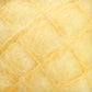 Close-up of a yellow textured material, resembling spun fibers or wool, with fine wispy strands creating a soft and fuzzy appearance. The fibers form a crisscross pattern, reminiscent of the luxurious Victorian Brushed Mohair Yarn from Caledonian Dye Works, giving the impression of a delicate and airy fabric.