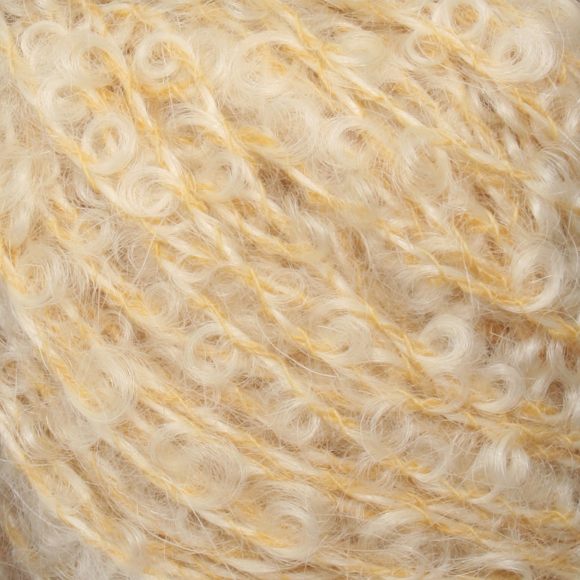 Close-up image of a ball of off-white, curly textured yarn with a slight yellowish tint. The yarn appears to be soft and fluffy, with loops and twists visible in the fibers. This delicate Victorian Bouclé Mohair Yarn from Caledonian Dye Works adds timeless elegance to any project.