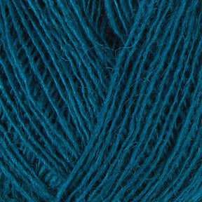 Close-up of Einband Lopi yarn strands woven together, creating a textured and intricate pattern akin to lace knitting. The fibers appear soft and slightly fuzzy, with varying shades of blue and green blending harmoniously. The image highlights the detailed structure of the Berroco, Inc.'s yarn.