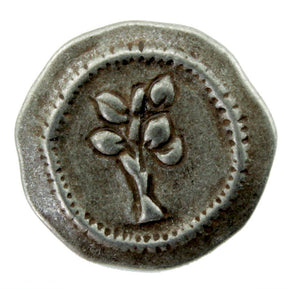 The Antique Metal Button from Dill Buttons of America, Inc. features a Tree of Life design with four leaves, centered and embossed on its round, weathered surface. The border of this button boasts a repetitive dotted pattern, giving it a worn, historical look.