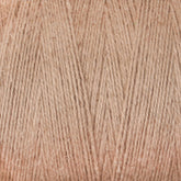 Close-up image of a spool of beige-brown yarn, showing the texture and detail of the fibers. The yarn, Maurice Brassard's 8/2 Cottolin Organic Yarn | Mini-Cone, is tightly wound in an organized manner, highlighting the individual strands and the soft appearance of the material—perfect for crafting elegant tea towels.