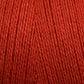 Close-up view of bright red 8/2 Bamboo Yarn from Maurice Brassard, tightly wound into a mini-cone. The texture of the yarn strands is clearly visible, showcasing the smooth and slightly glossy finish of the fibers—perfect for knitters seeking an environmentally friendly option with bamboo yarn's natural allure.