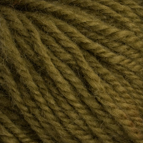 Close-up of Caledonian Dye Works' Halcyon Deco Rug Wool in olive green, showcasing its visible strands twisted together. The texture appears soft and slightly fuzzy, indicating that this 100% wool yarn is perfect for knitting or crocheting cozy items like sweaters or scarves.