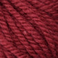 Close-up image of Halcyon Yarn Classic Rug Wool in a deep red hue from Caledonian Dye Works, highlighting its soft, fuzzy texture and tightly woven fibers. The yarn appears thick and hand-dyed, ideal for weavers who want to knit or crochet warm garments and accessories.