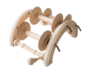 The Kromski North America Kromski Lazy Kate Arch is a light wooden yarn spinning tool with four spools arranged in a row on a curved, arc-like frame. This handcrafted device includes rods and pegs, designed for holding or winding ply yarn with tension control. The background is white.