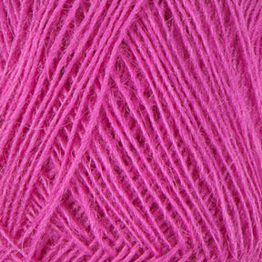 Close-up of a ball of pink Einband Lopi yarn by Berroco, Inc., showcasing a fine, soft texture with tightly wound threads. The yarn appears fluffy, suggesting a blend of fibers suitable for lace knitting and crafting projects.