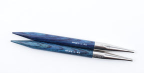 The Dreamz Interchangeable Knitting Needle Tips by Accessories Unlimited are displayed against a white background. Each tip showcases wooden ends with an elegant blue and black swirling pattern that transitions seamlessly into metallic silver tips, ensuring smooth joins. Ideal for knitting hats, these needle tips are marked with their US size: "US 11 - 8.00 mm.