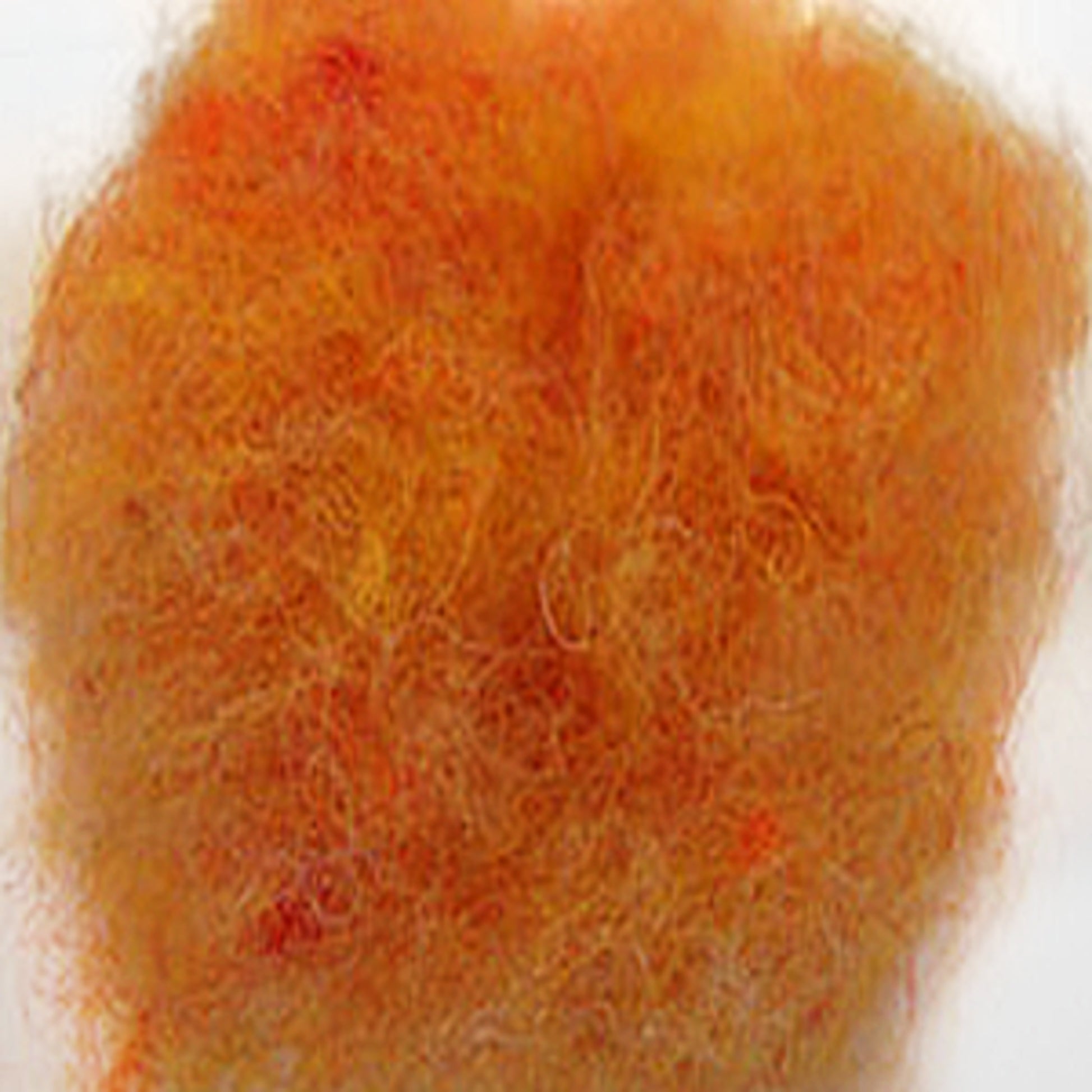 Close-up of Harrisville Dyed & Carded Wool Fiber by Harrisville Designs, showcasing a fluffy clump of fibers in a mix of warm, heathered colors - predominantly orange with hints of red and yellow. The texture appears soft and lightweight, highlighting the wool's natural characteristics against a plain white background.