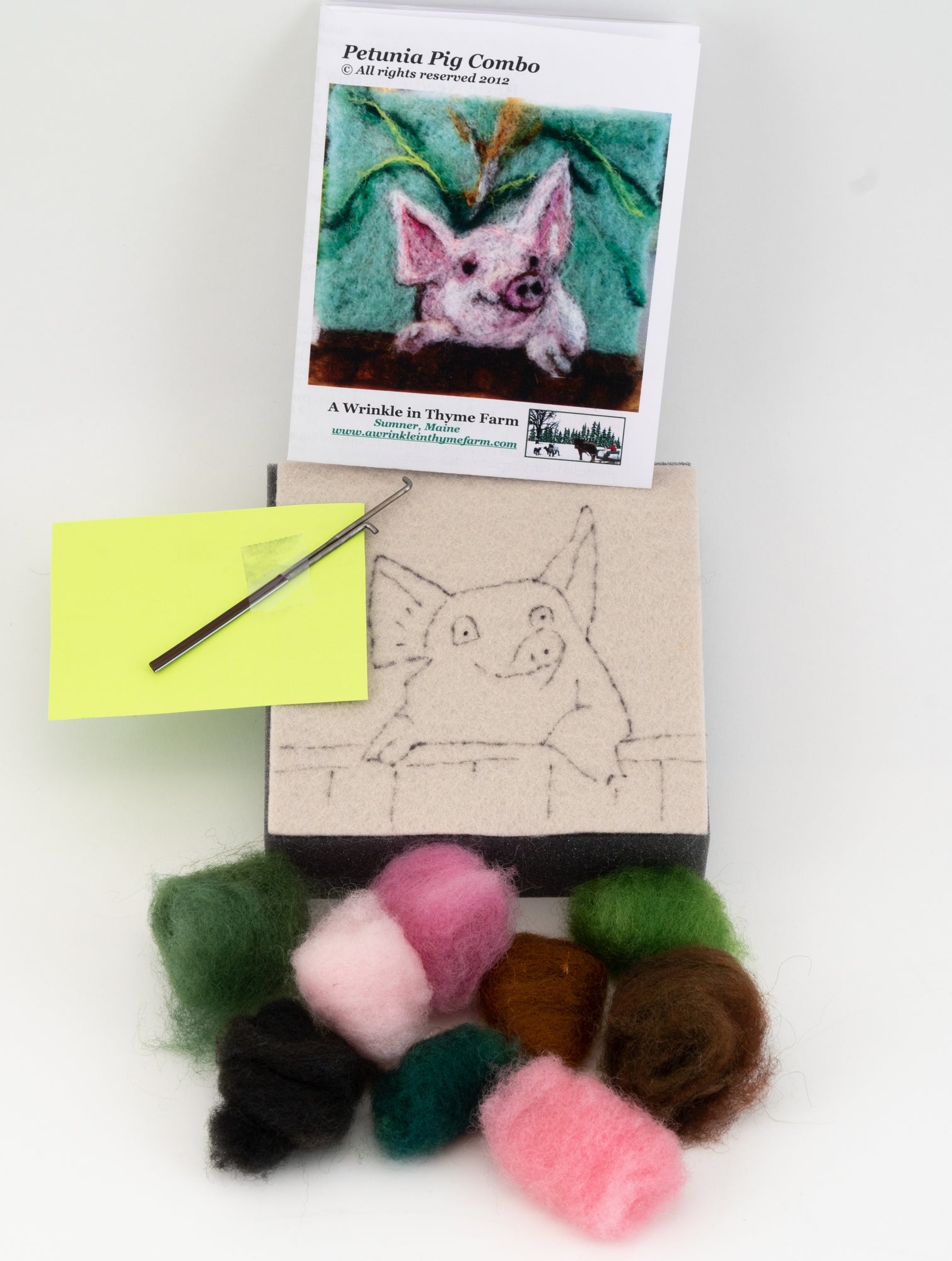 A Wrinkle in Thyme Farm presents the Thyme Tile Felting Kit (tools included), designed for beginner felters. The kit features colored wool roving, a felting needle, a foam pad with an outline of a pig and pre-arranged fibers, as well as an instruction booklet with an image of a pig titled "Petunia Pig Combo.