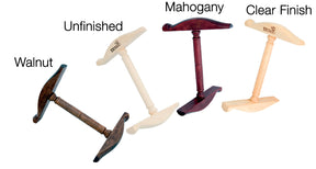 Four pegs for the Kromski Niddy Noddy from Kromski North America are displayed. From left to right, they are labeled as follows: "Walnut" (dark brown finish), "Unfinished" (natural light wood), "Mahogany" (reddish-brown finish), and "Clear Finish" (natural wood with clear coat).