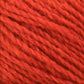 Close-up of a ball of Harrisville Designs Peace Fleece Yarn. The textured fibers of this wool and mohair blend are tightly wound together, showcasing a rich, vibrant color and detail in the strands.