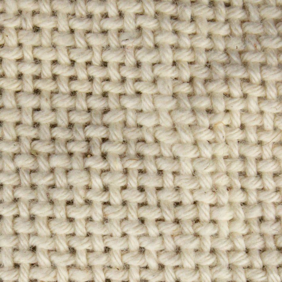 Close-up of the 60" Rug Backing from Dorr Fabrics Inc. This woven fabric texture in a natural, off-white color features interlaced threads forming a tight, uniform pattern, creating a thick and sturdy appearance. The material looks coarse and rugged, suggesting it might be durable and heavy-duty.