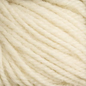 Close-up image of Halcyon Deco Rug Wool by Caledonian Dye Works showcases a soft, cream-colored yarn. The strands are thick, slightly fuzzy, and twisted together, creating a textured appearance. Made of 100% wool, this versatile yarn's light, natural shade is highlighted in the details of its fibers and twists.