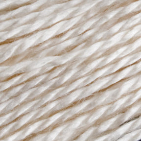 Here's a close-up image of the Henry's Attic 2/12 Natural Silk Yarn | Mini-cone. The soft, white yarn features a slight sheen and the fibers are twisted together in a subtle, diagonal pattern, creating a smooth and uniform texture. This finely spun yarn is lightweight and reminiscent of silk, making it ideal for delicate knitting or crocheting projects.