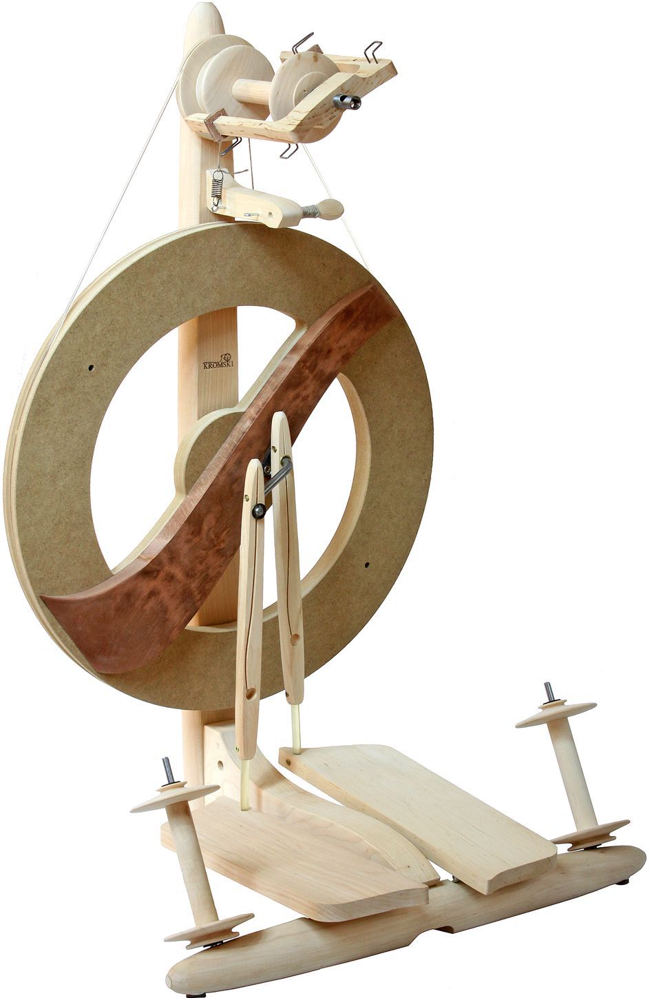 The Kromski Fantasia Spinning Wheel by Kromski North America is a wooden spinning wheel with a large circular frame and foot pedal mechanism. It boasts an elegant design that combines light and dark wood, showcasing detailed craftsmanship. This modern double drive wheel features Kromski bobbins and a flyer for expertly spinning fibers into yarn.