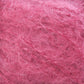 Close-up image of soft, fluffy pink fiber with an intricate web-like texture. The luxurious mohair fibers from the Victorian Brushed Mohair Yarn by Caledonian Dye Works appear fine and delicate, creating a cloud-like appearance with various shades of pink blending together.