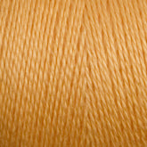 Close-up view of a spool of golden yellow 8/2 Tencel Yarn from Maurice Brassard. The threads are tightly wound in a crisscross pattern, creating a textured appearance. The smooth, shiny thread indicates the soft quality typical of Tencel yarn. Perfect for vibrant and warm knitting accessories or weaving projects.