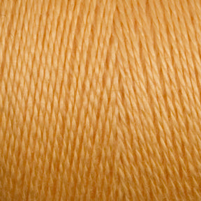 Close-up view of a spool of golden yellow 8/2 Tencel Yarn from Maurice Brassard. The threads are tightly wound in a crisscross pattern, creating a textured appearance. The smooth, shiny thread indicates the soft quality typical of Tencel yarn. Perfect for vibrant and warm knitting accessories or weaving projects.