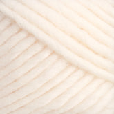 Close-up of a soft, bulky white yarn. The fibers are thick and intertwined, creating a fluffy and cozy texture. Ideal for knitting or crocheting warm garments and accessories, this Brown Sheep Lamb's Pride Worsted Yarn is perfect for felting projects.