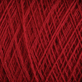 Close-up of JaggerSpun Maine Line 2/20 Yarn | Large Cone, wound tightly in a criss-cross pattern. The fibers, fabricated from medium-grade wool by Jagger Brothers, Inc., appear soft and slightly fuzzy, with varied shades of red creating a textured look. The yarn is evenly wrapped, forming a dense and consistent arrangement.