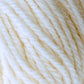 Close-up image of a skein of Halcyon Deco Rug Wool with a twisted texture. Made from 100% wool by Caledonian Dye Works, the yarn features a blend of light, creamy beige and off-white colors, creating a soft and warm appearance. The fibers appear slightly fuzzy and intertwined.