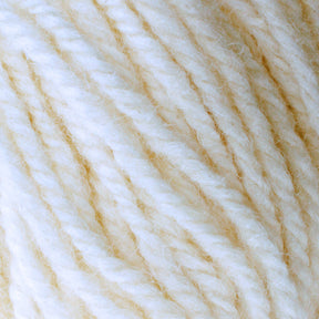 Close-up image of a skein of Halcyon Deco Rug Wool with a twisted texture. Made from 100% wool by Caledonian Dye Works, the yarn features a blend of light, creamy beige and off-white colors, creating a soft and warm appearance. The fibers appear slightly fuzzy and intertwined.