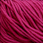 Close-up image of a bundle of bright magenta Plymouth Select Worsted Merino Superwash yarn by Plymouth Yarn Co., showing the texture and twisted strands in detail. The fibers appear soft and slightly fuzzy, with a consistent and tightly wound appearance that ensures excellent stitch definition.