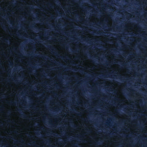 Close-up image of Victorian Bouclé Mohair Yarn by Caledonian Dye Works, showcasing blue, tightly wound curls that create a dense and textured appearance. The yarn strands reflect light beautifully, highlighting the depth and vibrancy of the blue color.