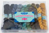 A transparent plastic box displaying ten mini skeins of 4-ply Mongolian cashmere yarn in various colors, including blue, green, yellow, brown, and gray. The label reads "Jade Sapphire Exotic Fibres Cashmere Coloring Box Yarn Pack." Perfect as a knitting kit, the skeins are neatly arranged in rows.