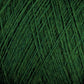 Close-up image of tangled green JaggerSpun Maine Line 3/8 Yarn from Jagger Brothers, Inc., showcasing a textured and layered pattern of fibers intertwined in various directions. The soft medium grade wool strands create a dense, intricate web of shades of green.