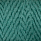 Close-up of Maurice Brassard's Medium Cotton 16/8 Mop Yarn in teal. The texture showcases several strands of sturdy cotton tightly wound together, forming a soft and even surface perfect for knitting or crocheting. The color is consistent throughout, displaying a rich, uniform hue.