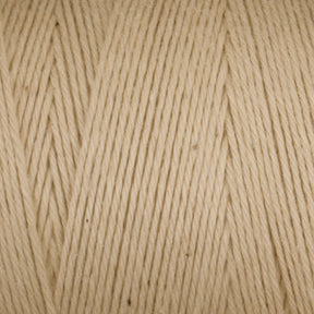 Close-up image of Maurice Brassard's Medium Cotton 16/8 Mop Yarn in beige, showcasing its soft texture and tightly wound strands. Ideal for knitting, weaving, and other crafts, this sturdy cotton yarn appears smooth and evenly spun. Small variations in color and texture can be seen, adding to its natural look.