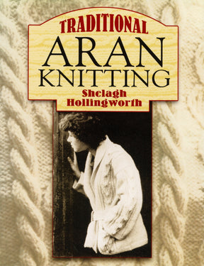 The book cover for "Traditional Aran Knitting" by Shelagh Hollingworth, under the Dover Books brand, showcases a sepia-toned image of a person adorned in an intricately designed Aran sweater. This visual is set against a cream-colored backdrop with a knitted pattern texture.