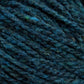 Close-up of dark teal blue Harrisville Highland - Cones by Harrisville Designs, showing the texture of the twisted fibers. The unscoured yarn has subtle variations in color, creating a rich, slightly mottled effect.