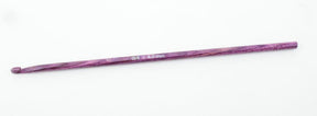 A purple crochet hook, size "G/6 4.0 mm," is displayed on a plain white background. The handcrafted Knitter's Pride Symfonie Dreamz Wooden Crochet Hook from Accessories Unlimited features a smooth, polished finish.