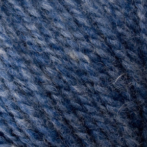 Close-up image of blue Bartletts Maine Wool - Sport yarn with subtle variations in the shade. The texture shows the twisted strands of the Bartlettyarns' wool, with some fibers slightly protruding, giving it a fuzzy appearance.