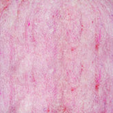 Close-up image of a pink textured surface, possibly fabric, skin, or another organic material. The texture shows variations in heathered colors of pink with subtle patterns throughout, reminiscent of Harrisville Designs' Harrisville Dyed & Carded Wool Fiber.