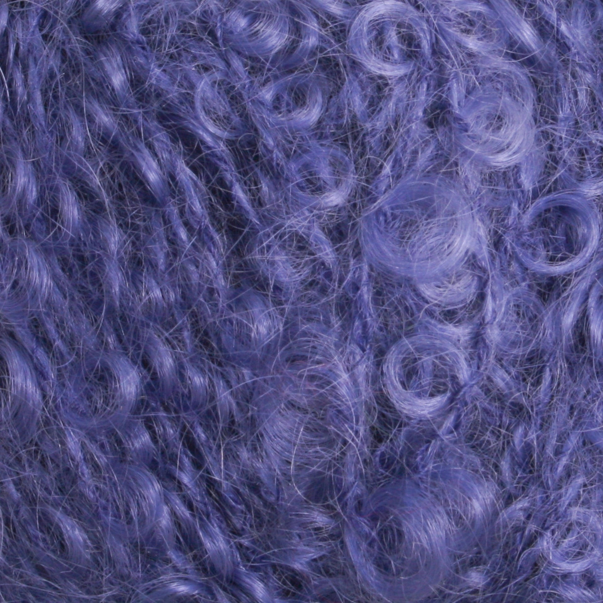 Close-up of a dense cluster of curly, purple fibers creating a soft, textured surface. The curls are tightly wound and intermingled, showcasing a variety of purple hues reminiscent of the Victorian Bouclé Mohair Yarn by Caledonian Dye Works, crafting a vibrant pattern worthy of Halcyon's Signature Victorian Collection.