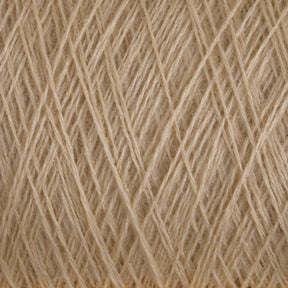 Close-up shot of JaggerSpun Maine Line 3/8 Yarn by Jagger Brothers, Inc., wrapped tightly and crossed in various overlapping directions, creating a textured, woven pattern. The fibers appear natural and slightly coarse.