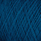 Close-up of tightly wound JaggerSpun Maine Line 3/8 Yarn | Large Cone from Jagger Brothers, Inc., showing the intricate crisscross pattern of the threads. The texture is soft and fibrous, with subtle variations in the hue of the blue strands. The image highlights the detailed structure of this soft, medium grade wool.