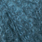 Close-up image of curly, textured fibers in a soft, teal-blue color, possibly depicting Victorian Bouclé Mohair Yarn from Caledonian Dye Works. The curls create a dense and intricate pattern reminiscent of Halcyon's Signature Victorian Collection.