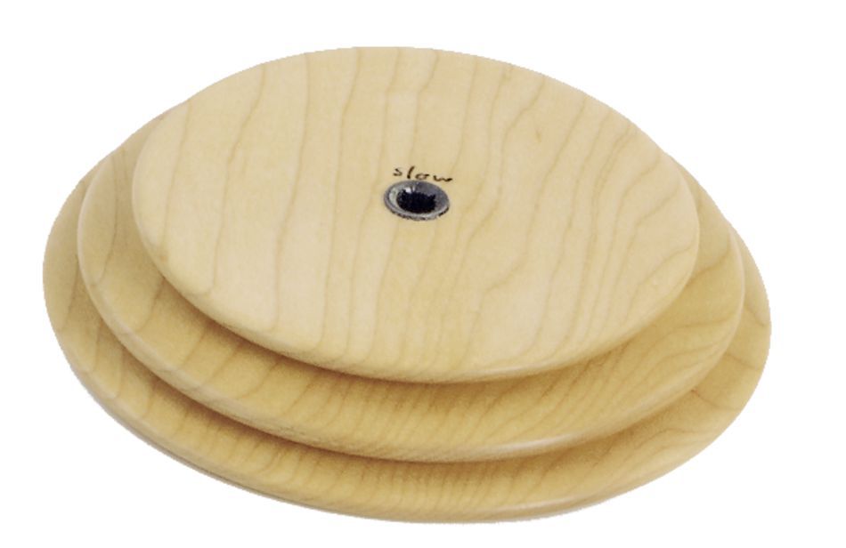 Introducing the Schacht Whorl from Schacht Spindle Co., a set of three nested wooden discs varying in size, stacked one on top of the other. The smallest disc features a black screw at its center with the word "slow" written near it. Crafted from light-colored wood and finished smoothly, this elegant set is both functional and beautiful.