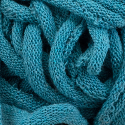 Get a close-up look at the Harrisville Potholder Loops - Traditional Size Mini Pack from Friendly Loom, featuring tightly knit, teal-colored fabric with intricate woven patterns and thick yarn strands that evoke the craftsmanship of a traditional loom. The texture is soft and slightly fuzzy to the touch.