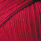 Close-up image of a ball of vibrant red yarn. The strands, made from Jo Sharp Soho Summer DK Cotton by Kingfisher Yarn & Fibre, are neatly wound, showcasing the texture and individual fibers. This lightweight cotton yarn dominates the image with its brilliant hue.